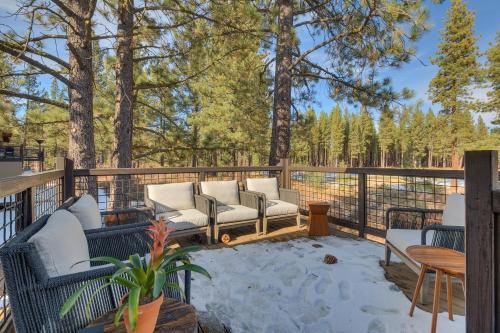 a patio with couches and tables on a fence at Truckee Luxe by Tahoe Getaways - 3 BR Luxury Gray's Crossing Townhome w Hot Tub on Golf Course - Close to Downtown & Northstar in Truckee