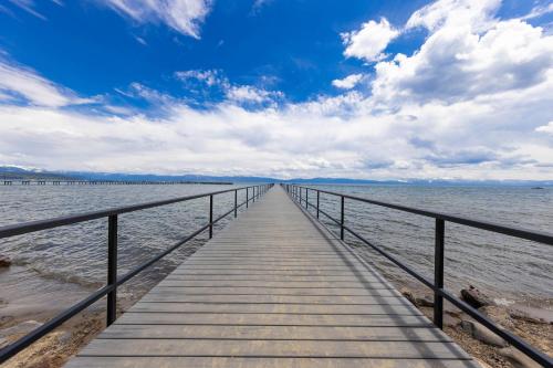 a wooden pier stretches out into the water at Starry Skies on the West Shore, Private Beach, Fireplace, Pet Friendly, Close to Ski Resorts in Tahoe City