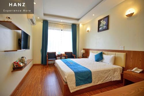 a hotel room with a bed and a window at S79 Noi Bai Airport Hotel in Hanoi