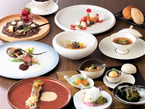 a group of plates of food on a table at Hotel Shiki no Yakata Nasu in Nasu