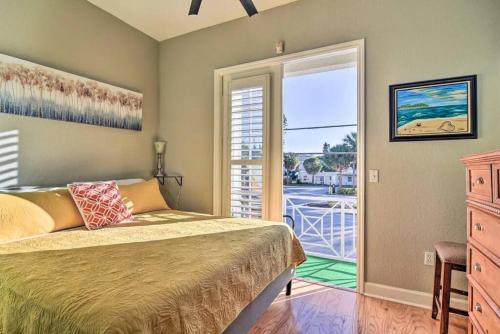 a bedroom with a bed and a large window at Coastal Sea Side Townhome in Clearwater Beach