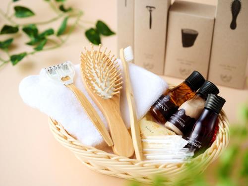 a basket with toothbrushes and essential oils in it at Imperial Hotel Osaka in Osaka