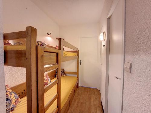 a room with two bunk beds and a hallway at Studio Montvalezan-La Rosière, 1 pièce, 4 personnes - FR-1-275-205 in Montvalezan