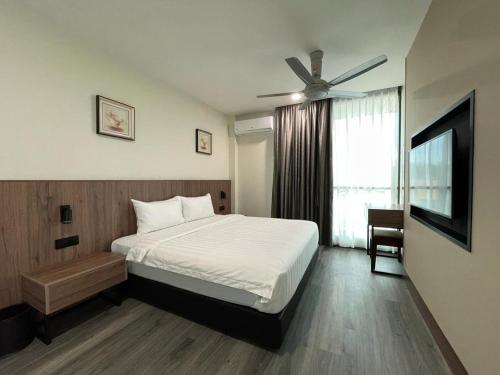 Postel nebo postele na pokoji v ubytování Hotel Bundusan