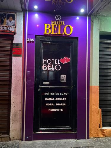 a purple door with a motel beta sign on it at Belo Motel in Belo Horizonte