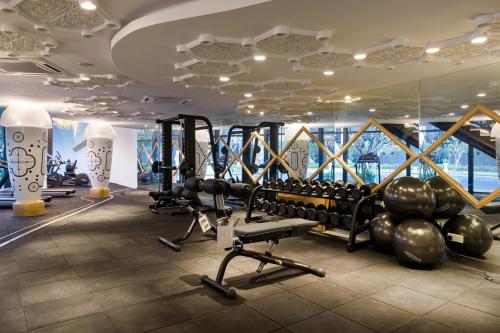 a gym with treadmills and weights in a building at Arena Gaming Suite In Arte Mont Kiara in Kuala Lumpur