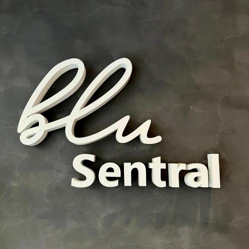 a white sign that says spa central on a wall at Blu Sentral Hotel in Tawau