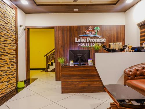 a living room with a lobby with a living room at Alice Lake Promise in Alleppey