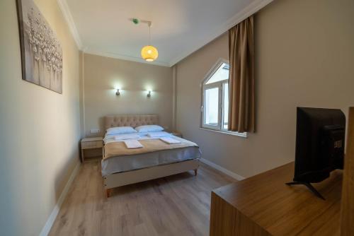Postel nebo postele na pokoji v ubytování REGA OTEL
