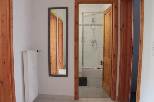 a bathroom with a mirror and a bath tub at Heike in Willich