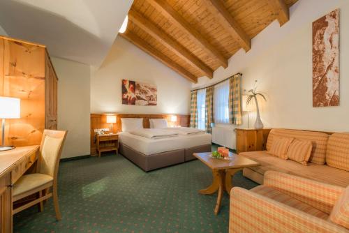 A bed or beds in a room at eva,VILLAGE