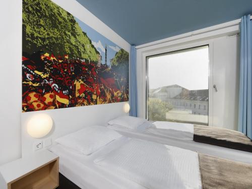 Postel nebo postele na pokoji v ubytování B&B Hotel Berlin-Tiergarten