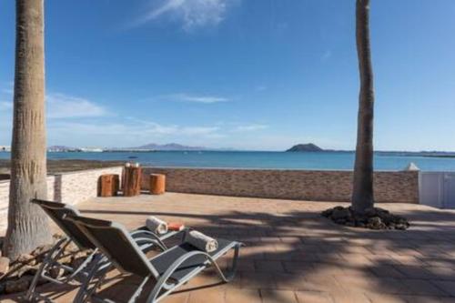 Beachfront Villa San Antonio with Private Heated Pool BBQ in the Heart of Corralejo by Amazzzing Travel