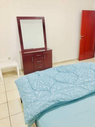 Postel nebo postele na pokoji v ubytování Private Room in Dubai-Sharjah Border
