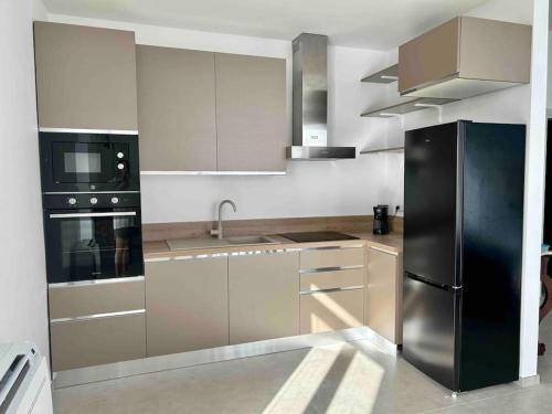 Kuchyň nebo kuchyňský kout v ubytování L'Ancora appartamenti 3