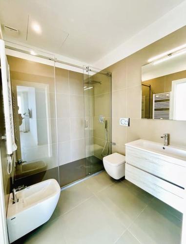a bathroom with a sink and a toilet and a shower at L'Ancora appartamenti 3 in Giovinazzo