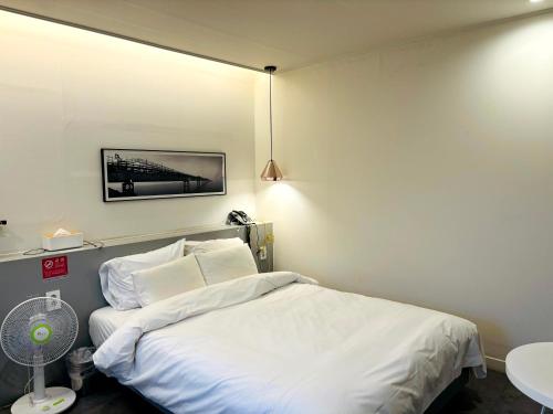 Postel nebo postele na pokoji v ubytování Hotel Yam