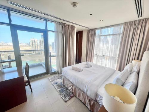 a hotel room with a bed and a large window at Spirit Tower - 1BR Apartment - Allsopp&Allsopp in Dubai