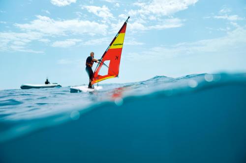 a man on a sail board on the water at TUI MAGIC LIFE Sarigerme in Sarigerme