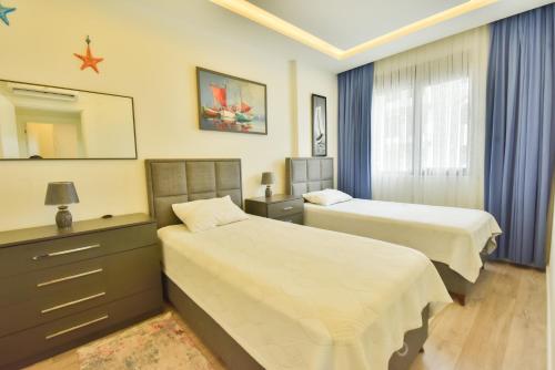 Postel nebo postele na pokoji v ubytování Апартаменты Best Home 26 Cleopatra Legacy No 8