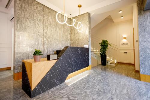 a lobby of a hotel with a reception desk at Revive Boutique Hotel in Yerevan