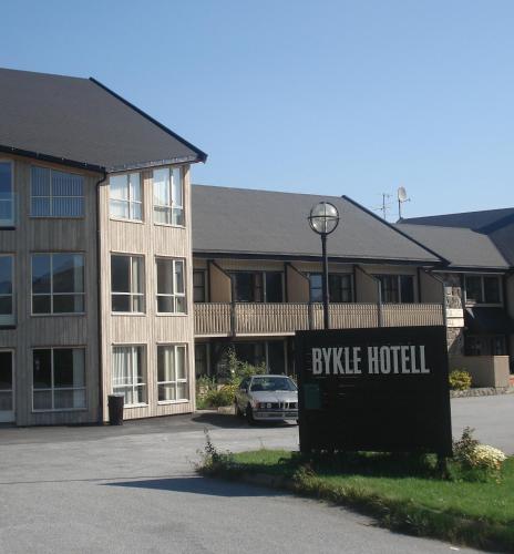 a hotel sign in front of a building at Bykle Hotel in Bykle
