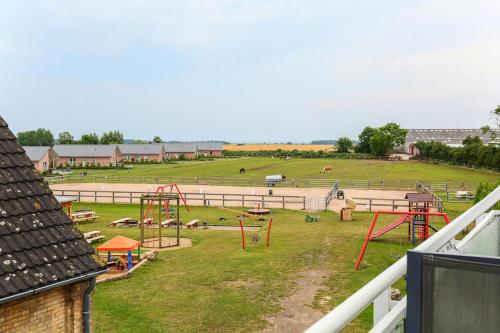 a park with a playground with a play area at Buedlfarm-NordOst in Sahrensdorf