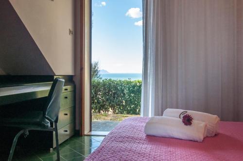 En eller flere senge i et værelse på Casa Vacanza Kair Bilo 218