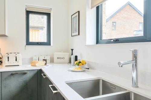 a kitchen with a sink and a window at Equinox in Dorchester