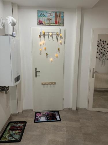a room with a white door with lights on it at Dachgeschoss City Apartment in Zentrum Wiens in Vienna