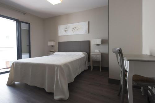 Ein Bett oder Betten in einem Zimmer der Unterkunft Hostal Emeritae