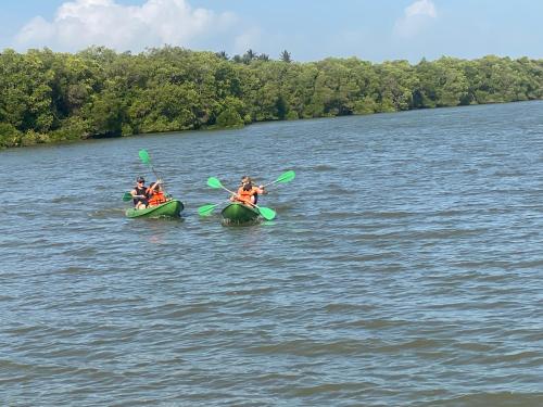 a group of people in kayaks on a lake at See Turtle Villa in Tangalle