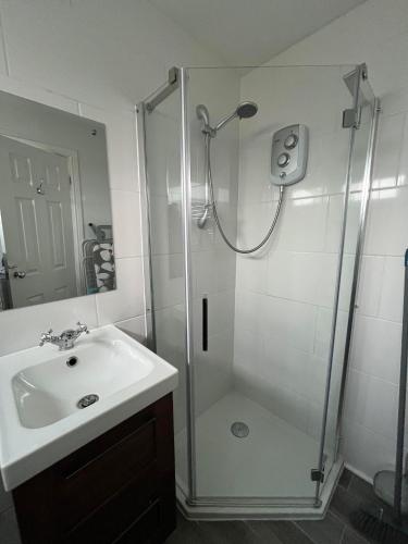 a bathroom with a shower and a sink at 194, Two bed Chalet on Belle Aire Holiday Park - sleeps 4, pet friendly, free Wi-Fi, bed linen and towels included plus onsite entertainment available in Hemsby