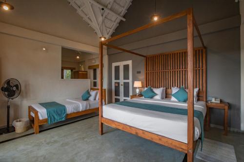 a bedroom with two beds in a room at Serenite Ella in Ella