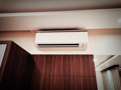 a air conditioner on a wall in a room at Sambhabana Hotel & Suites in Tarapith