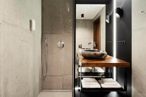 a bathroom with a sink and a shower at New Port - Hotel na Wiśle in Kraków