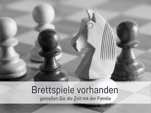 a chess board with chess pieces on it at RamosHansenHof Fewo Nordlicht 6 Personen Hund inklusiv in Steinberg