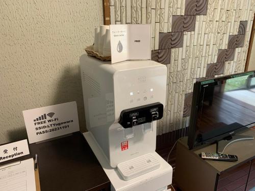 a video game system sitting on top of a desk at HOTEL LT Kitchen Yugawara in Yugawara