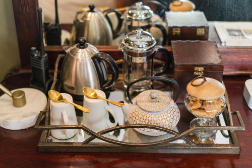 a tray with spoons and other items on a table at Last Word Madikwe in Madikwe Game Reserve