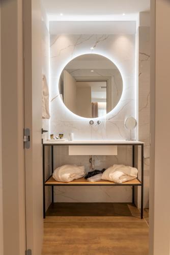 a bathroom with a sink and a mirror at Nicolas Centrale-Smart City Suites in Igoumenitsa
