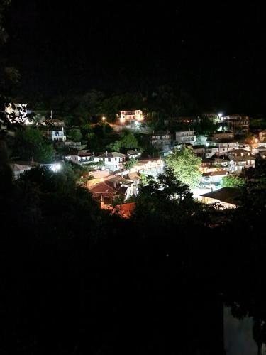 a view of a city at night with lights at MELATO HOUSES in Valtessiniko 