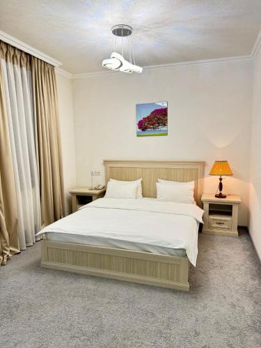 Postel nebo postele na pokoji v ubytování Alexander Hotel