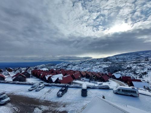 an aerial view of a town covered in snow at Casa da Bela Vista - Serra da Estrela in Covilhã