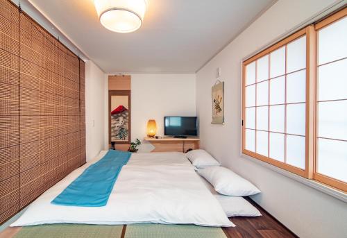 Postel nebo postele na pokoji v ubytování KYARA Hotel 浅草