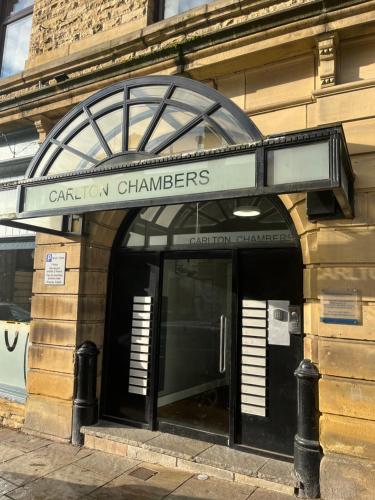 a building with a sign that reads central chambers at Stylish apartment in the centre of Hebden Bridge. in Hebden Bridge