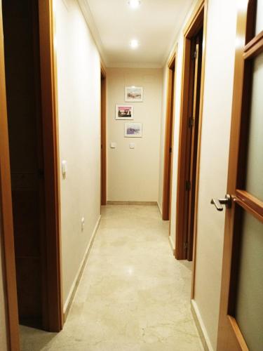 a corridor of a room with a hallway at EL RINCÓN DEL GUADALQUIVIR in La Rinconada