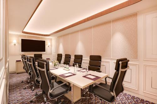 a conference room with a table and chairs at Aurika, Mumbai International Airport - Luxury by Lemon Tree Hotels in Mumbai