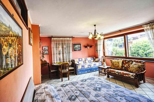 a living room with a couch and a living room with at Casa Nicolò in Massa Lubrense