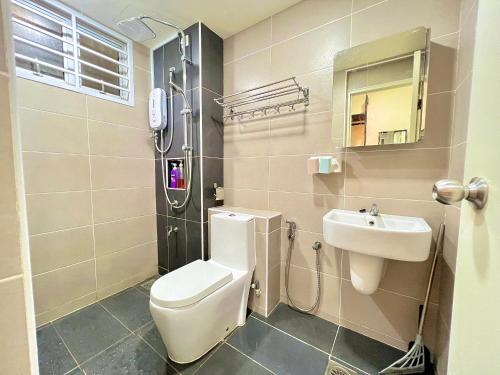 a bathroom with a toilet and a sink at D'Putra Suites 418 5-6 pax 2BR 