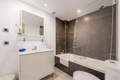 a bathroom with a sink and a toilet and a shower at Js Villas rental Ap La Perla 5 Puerto Pollensa in Port de Pollensa